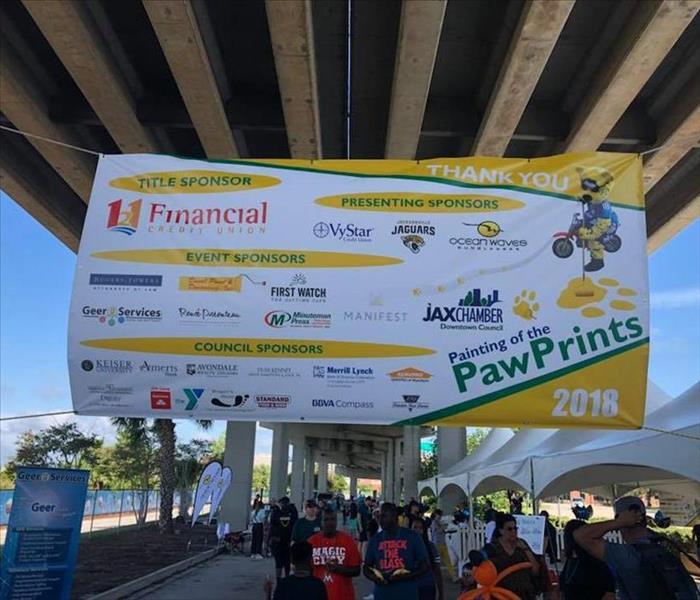 Image shows sponsorship banner hanging for a community event.